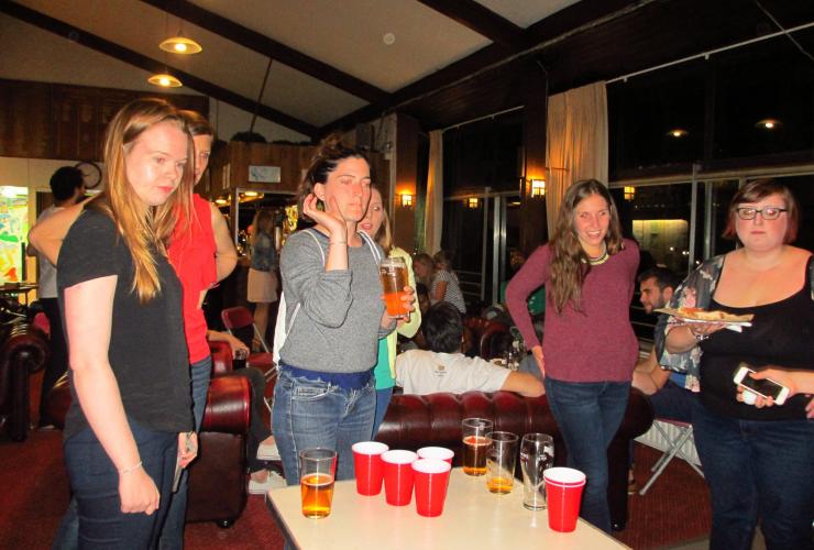 People playing beer pong